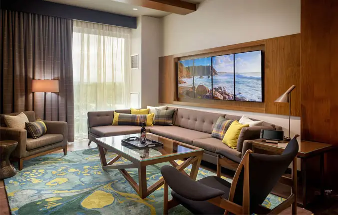 An image of the layout of the Cascade room highlighting the sectional couch and the wall art.